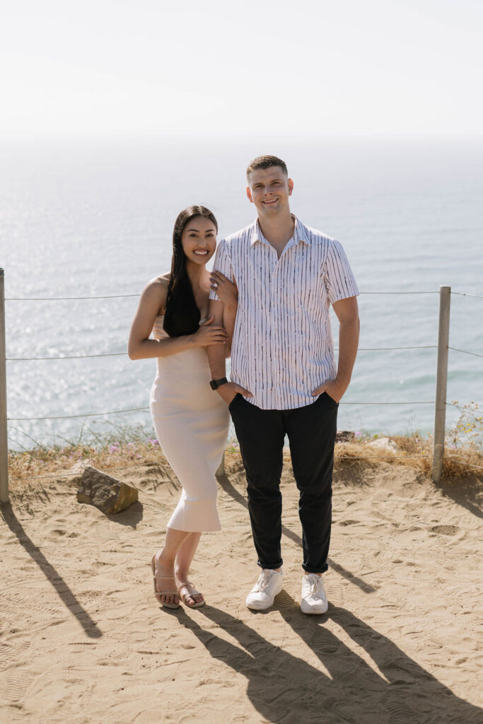 newly engaged couple at their fun and adventurous engagement session at Guy Fleming Trail