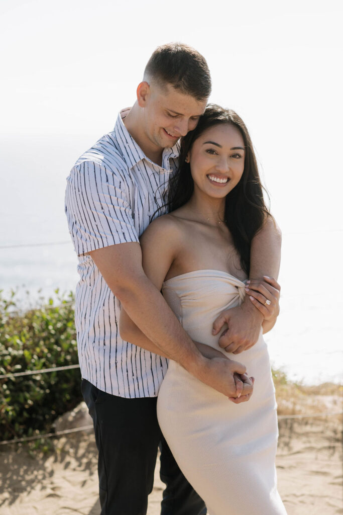 newly engaged couple hugging at Guy Fleming Trail