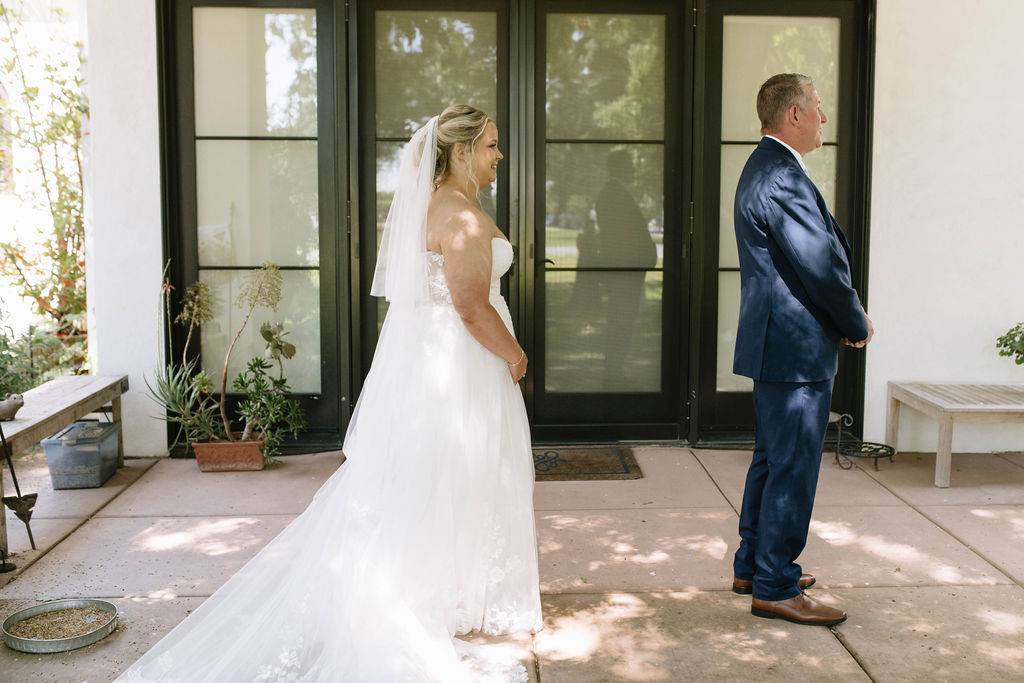 bride before her first look with her dad