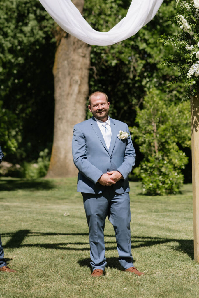 groom waiting for the bride at the aisle 