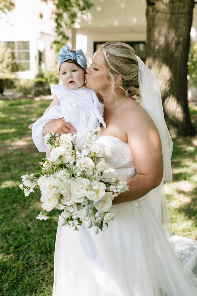 bride holding her daughter