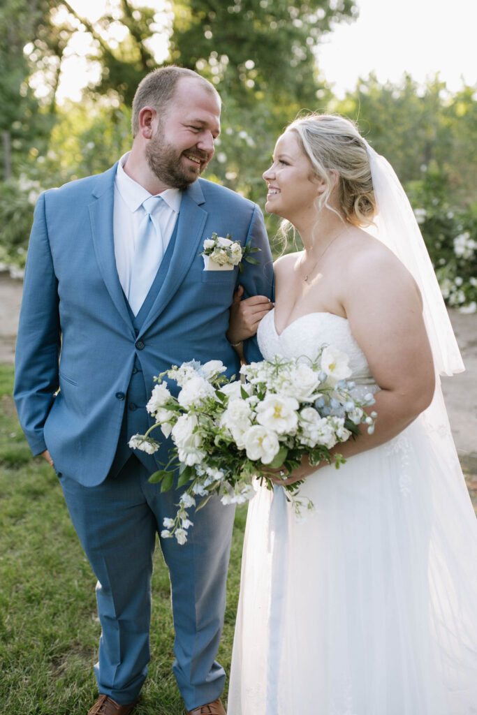 bride and groom looking at each other 