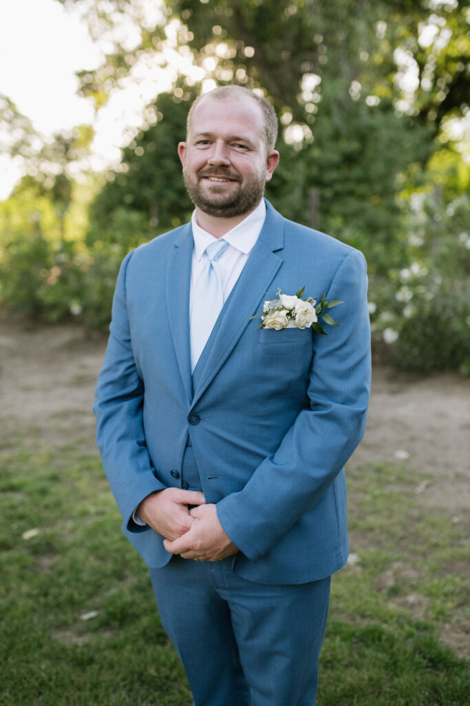 groom looking at the camera