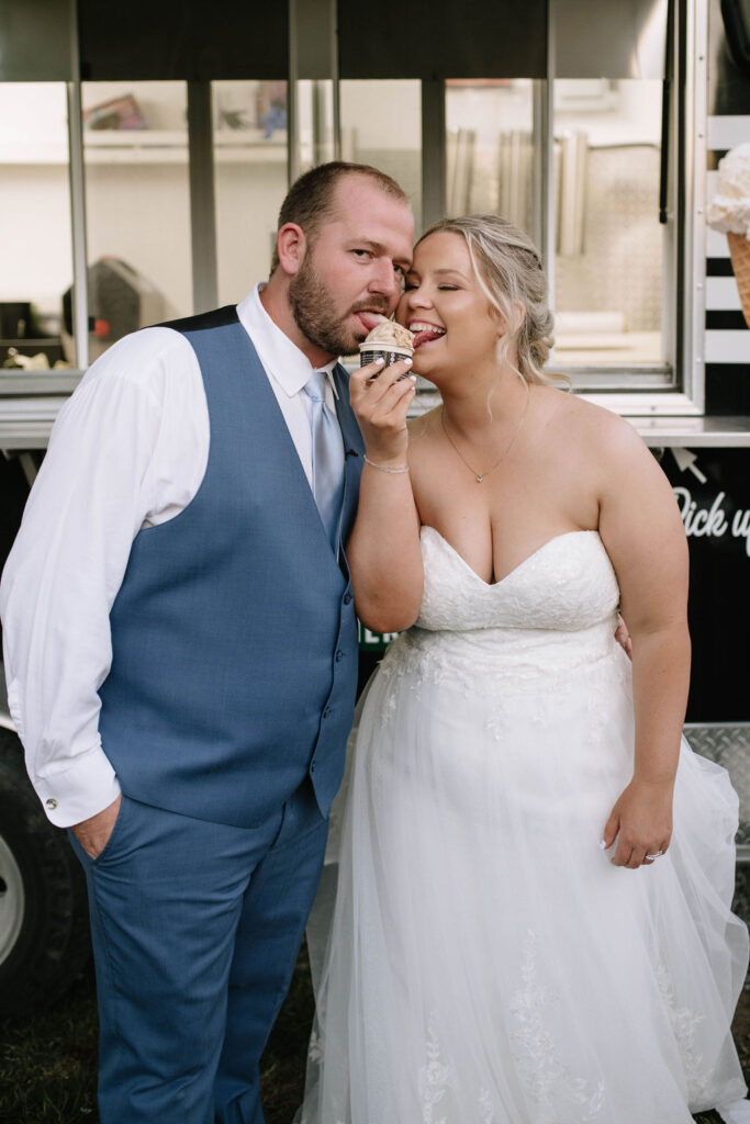 bride and groom eating ice cream