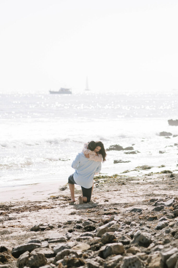 couple hugging after their proposal 