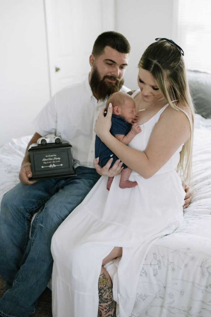 parents looking at their newborn baby