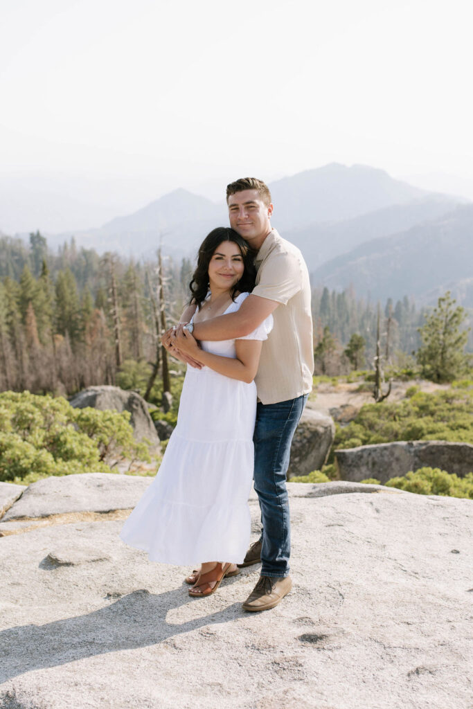 newly engaged couple hugging during their photoshoot