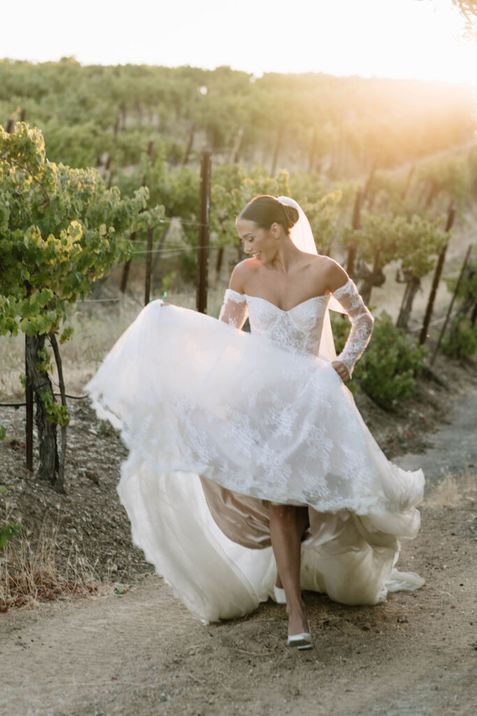 bride walking around the vineyard 